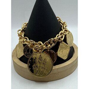 Gold Tone Coin Charm Bracelet With Assorted Currency Designs On Chunky Chain
